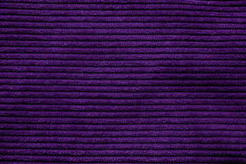 Closeup of purple corduroy cloth as patterned textured background
