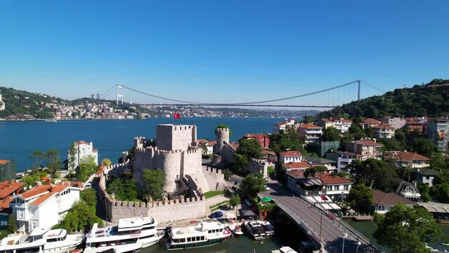 Fatih Sultan Mehmet Bridge and Anadolu Hisari (Anatolian Fortress) in Istanbul, Turkey. Beautiful Istanbul bosphorus landscape. Drone shot.