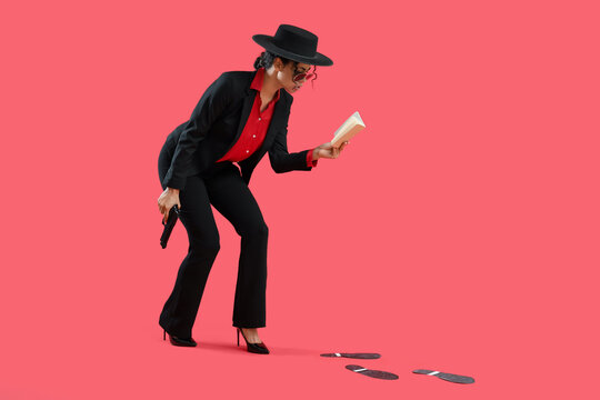 Female African-American spy with gun and notebook tracing footprints on red background