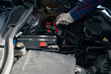 Close up photo of man installing relay