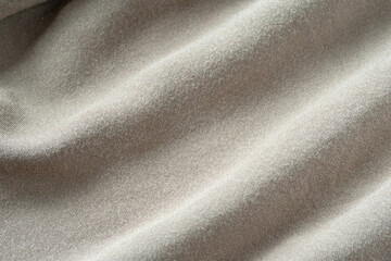 Fototapeta premium Fabric texture with folds. Natural cotton fabric. Folds in fabric