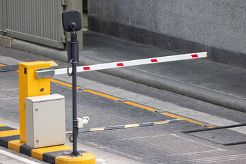 car park barrier with recoding CCTV camera, automatic entry system.