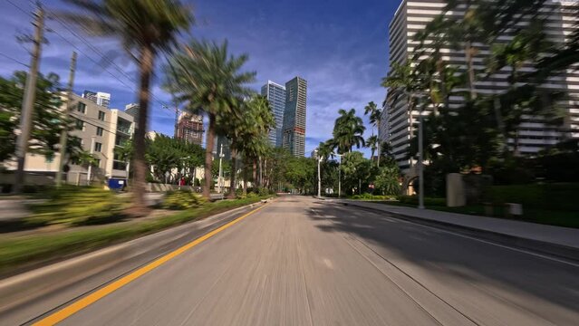 Point of view of car view driving plate on Miami Brickell city streets architecture. POV vehicle driving along downtown Miami during daytime