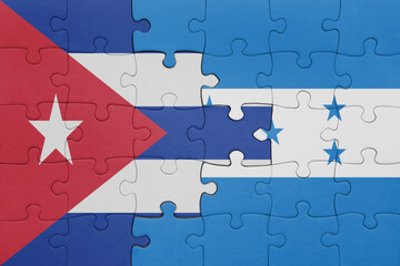 puzzle with the colourful national flag of honduras and flag of cuba .