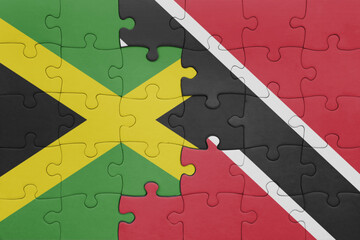 puzzle with the colourful national flag of trinidad and tobago and flag of jamaica .