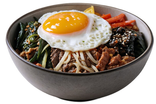 Traditional Korean bibimbap in a bowl topped with a sunny-side-up egg, png, isolated on a white background