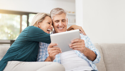 Couple, read and tablet on sofa for social media, laugh and meme online on couch. Technology,...