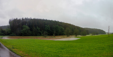 Meadows flooded by the Anhauser stream in the district of Augsburg in Germany, Reinhartshausen, 1 June 2024