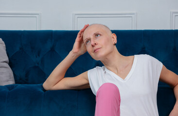 Portrait of daydreaming woman after victory over breast cancer