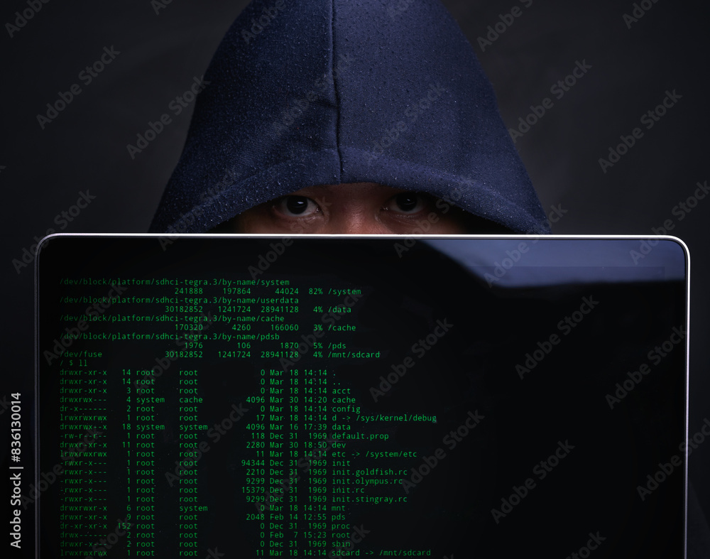 Poster laptop, screen and portrait of hacker in studio for ransomware, cyber attack and crime on server. cy