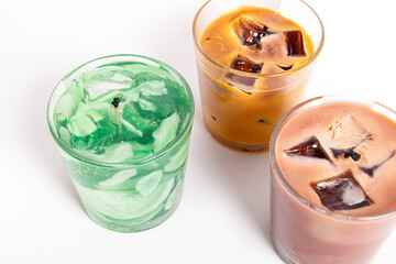 Trendy gel candles in glass cups. Candles in the form of drinks. Mojito and iced coffee