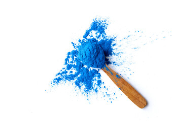 Organic Blue Spirulina Powder on a Wooden Spoon. Top View. Copy Space. Natural Food Coloring Concept