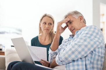 Couple, couch and document with laptop and stress, finances or taxes for debt in living room....