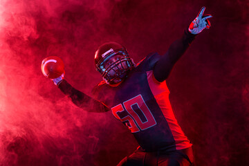 American football player banner on red neon background. Template for bookmaker ads with copy space....