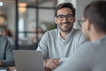 Obraz premium Happy business man having a meeting with his team 