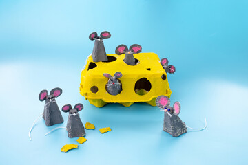 Creative craft project made from yellow egg carton, transformed into six mice
