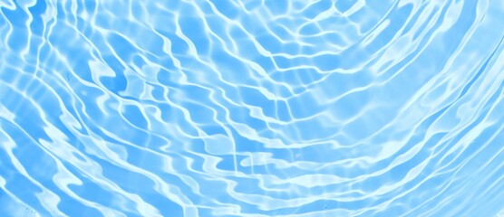 Desaturated clear blue waves. Smooth wavy surface with splashes. Trendy tropcal background, abstract summer banner, top view mockup for beauty products. blue water background