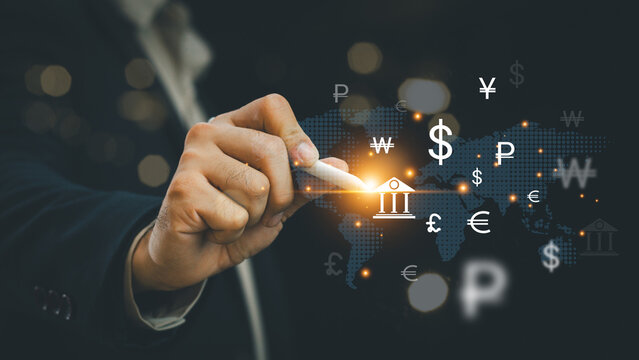Global currency exchange concept, Businessman holding virtual world map and dollar yuan yen euro and pound sterling sign. Global business, international trading currency, world economy money, transfer