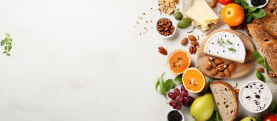 Delicious breakfast or snack featuring cheese, pear, honey, and nuts on a light background in a top view copy space image.