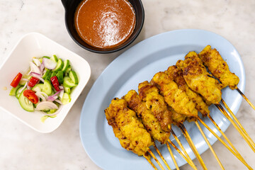 Pork satay or Grilled pork served with peanut sauce or sweet and sour sauce - Asian food Concept style Thai food on white background.