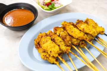 Pork satay or Grilled pork served with peanut sauce or sweet and sour sauce - Asian food Concept style Thai food on white background.