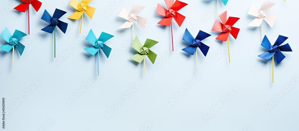 Poster two pinwheels displayed against a white backdrop with copy space image.