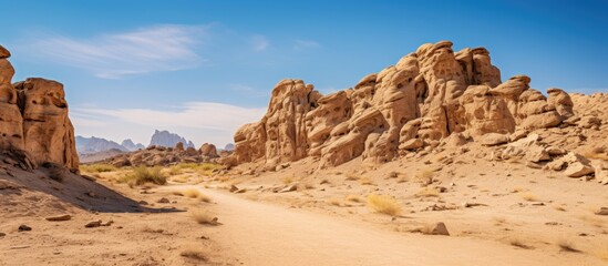 A desert rock formation shown on a white background with copy space image.