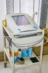 modern physiotherapy machine in the room at a clinic, screen on for new patient