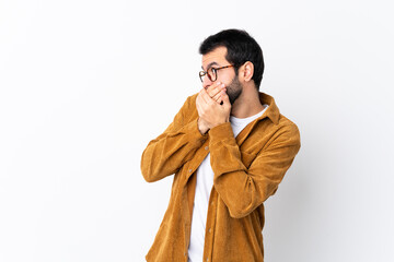 Caucasian handsome man with beard wearing a corduroy jacket over isolated white background covering...