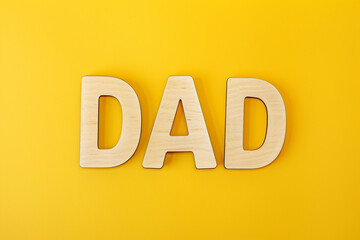 Father's Day letters symbolizing the word father with yellow background