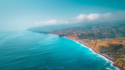 Fototapeta premium Aerial view of a stunning coastal line in Sao Vicente, Madeira, with clear blue waters and lush landscapes.