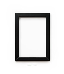 Fototapeta premium Black picture frame on white background, no text or letters inside the black wooden photo frame, isolated, flat lay