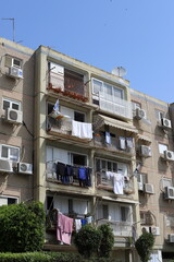 Obraz premium Washed laundry hangs on a rope outside the window.