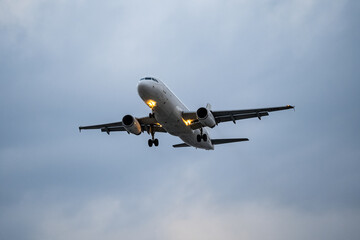 Airplane  registration flying on cloudy day, approaching landing in Tan Son Nhat Airport in Vietnam