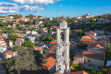 Bell tower and traditional stone houses in a historic village of Lofou. Limassol District, Cyprus