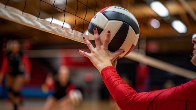 A man is playing volleyball in front of a crowd