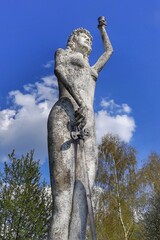statue of a person with a sword