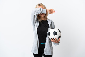 Young Russian woman playing football isolated on white background covering eyes by hands