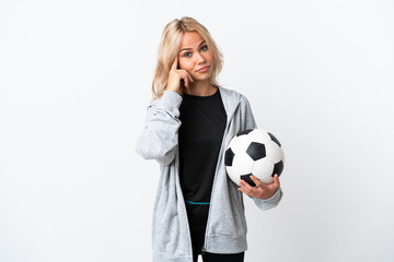 Young Russian woman playing football isolated on white background thinking an idea