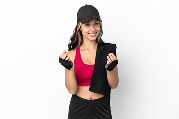 Sport Russian girl with hat and towel isolated on white background making money gesture