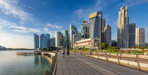 Singapore, February 03, 2024: Panorama of Singapore skyline with Merlion statue fountain.