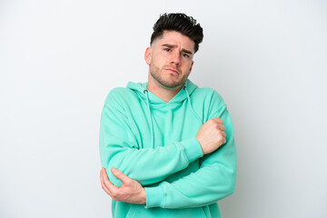 Young caucasian man isolated on white background with pain in elbow