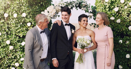 Couple, parents and wedding with flowers, smile and love for marriage, commitment and celebration....
