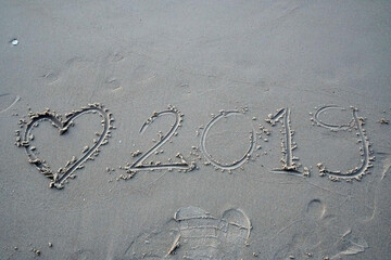 Nature scene of gray sand with drawing heart patterns on the sand texture background - valentine theme - image from sattahip  Thailand 
