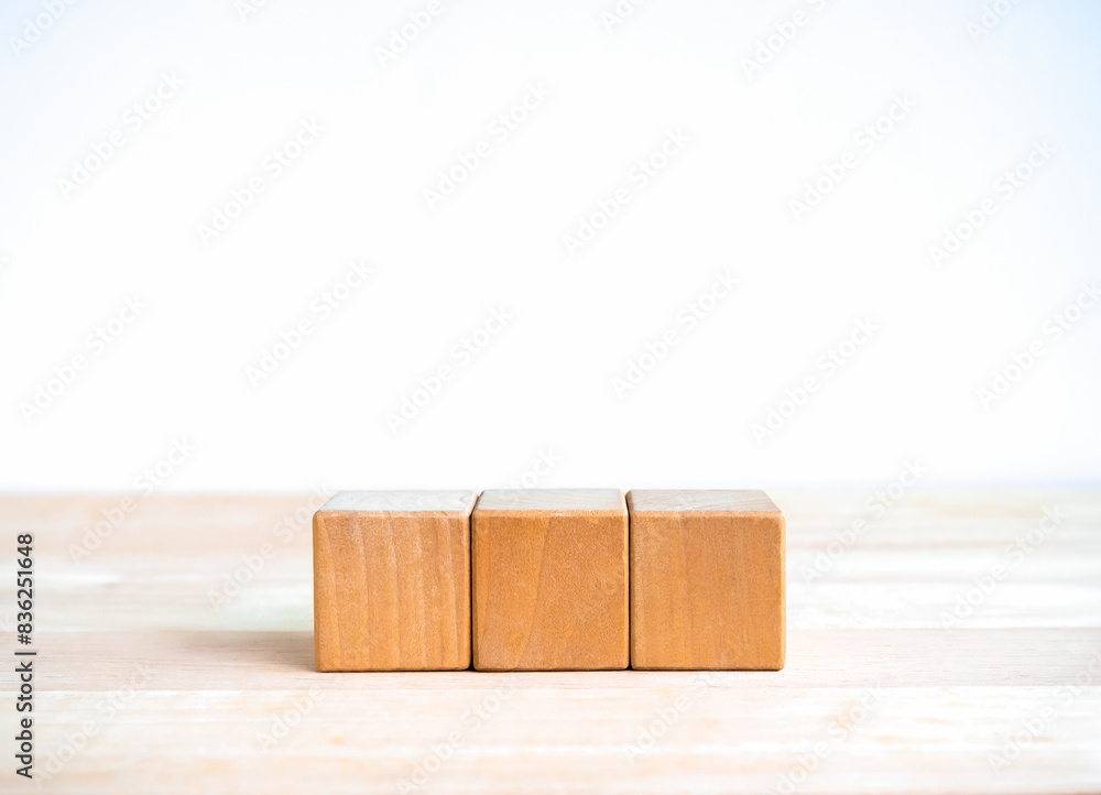 Aufkleber 3 wood blocks isolated on wooden table, white banner background with copy space. empty blank templat