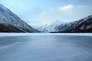 Snow-covered winter mountain lake, Russia, Siberia, Altai mountains.