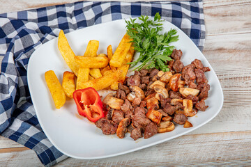 Turkish Cuisine Meat Saute with Mushrooms. Roasted beef with Red Tomatoes (turkish name ,domatesli sote kavurma).