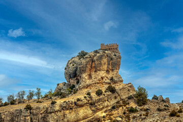 Remains of the Benizar castle on top of a hill in the Sierra de Moratalla, Region of Murcia, Spain, in a beautiful natural environment