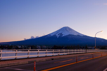 Naklejka premium The view of town buildings with Mount Fuji in the background.
