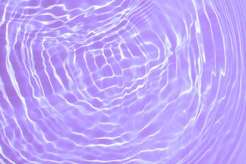Transparent clear purple water surface texture with with beautiful splashing ripples and bubbles. Trendy abstract nature summer background. Water waves with sunlight. Minimal summer idea. copy space